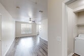 This single-story, 2-bedroom, 2-bathroom residence on Westhollow Drive in Houston, Texas offers a thoughtfully designed layout with a clean, neutral aesthetic throughout. The living room features wood-look flooring, a ceiling fan, and windows that invite natural light, creating a bright and welcoming atmosphere. It flows seamlessly into the combined dining area and kitchen, which is outfitted with white shaker-style cabinetry, light countertops, a stainless steel dishwasher, and a full suite of appliances — ideal for everyday cooking and entertaining.

Both bedrooms are generously sized, with plush carpeting, ceiling fans, and windows that provide ample natural light. The spacious primary bedroom connects to a well-sized walk-in closet featuring built-in shelving and rod systems, offering exceptional storage capacity. In total, the residence includes four closets, ensuring abundant storage throughout.

The two bathrooms are finished with white vanities, wood-look tile flooring, and tub-shower combinations. A dedicated laundry area houses a full-size washer and dryer. Additional utility and hallway spaces round out the functional floor plan, making this a practical and comfortable Houston residence.