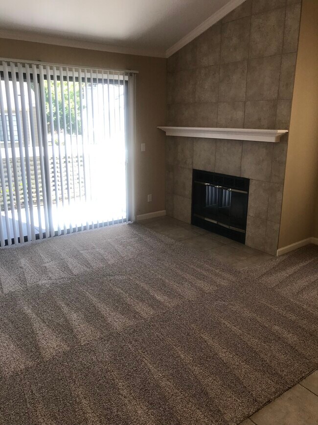 Living room with wood burning fireplace - 357 Eastridge Dr