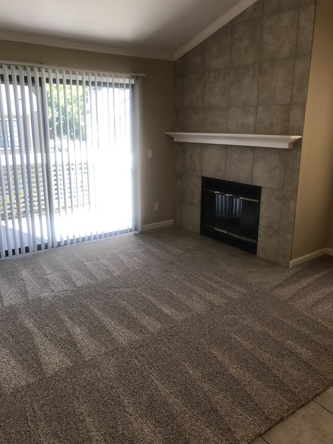 Living room with wood burning fireplace - 357 Eastridge Dr