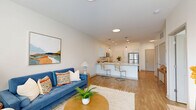 Located at 2110 E Southport Rd in Southport, Indiana, this well-appointed 1-bedroom, 1-bathroom unit offers a thoughtfully designed single-floor layout with modern finishes throughout. The open-concept living and kitchen area serves as the heart of the home, where warm wood-look flooring, recessed lighting, and large windows work together to create a bright, inviting atmosphere. The living area provides generous space for relaxing and entertaining, with access to a patio door that brings in abundant natural light.

The kitchen is a standout feature, showcasing white shaker cabinetry, a classic subway tile backsplash, quartz countertops, and a full suite of stainless steel appliances including a gas range, microwave, dishwasher, and refrigerator. A peninsula with bar seating adds both functionality and style, serving as a natural divider between the kitchen and living space.

The bedroom is a comfortable retreat, featuring a ceiling fan, a well-sized window with outdoor views, and easy access to a dedicated closet. The full bathroom is clean and contemporary, complete with a white vanity offering ample storage, a large mirror, and wood-look flooring. A dedicated laundry area with a stacked washer and dryer adds everyday convenience to this efficient, modern home.