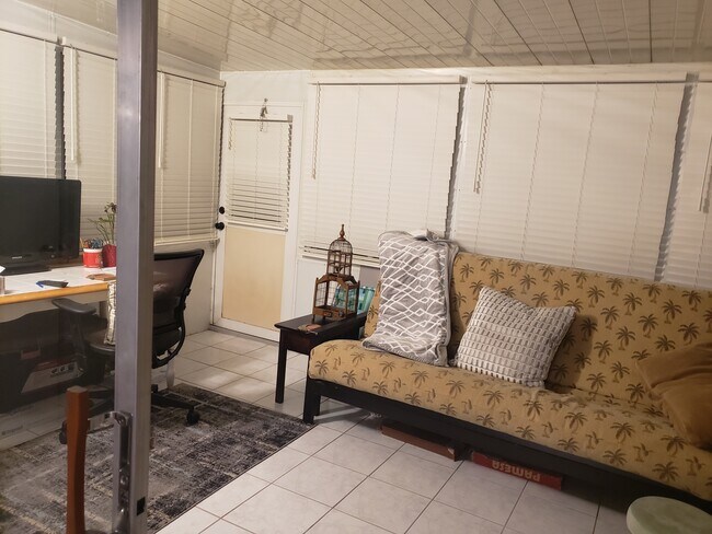 Enclosed patio with desk and futon bed - 1041 Orange Ter