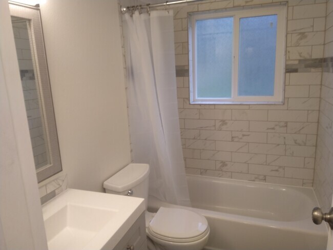 Custom tiled tub surround - 8848 W Jewell Ave
