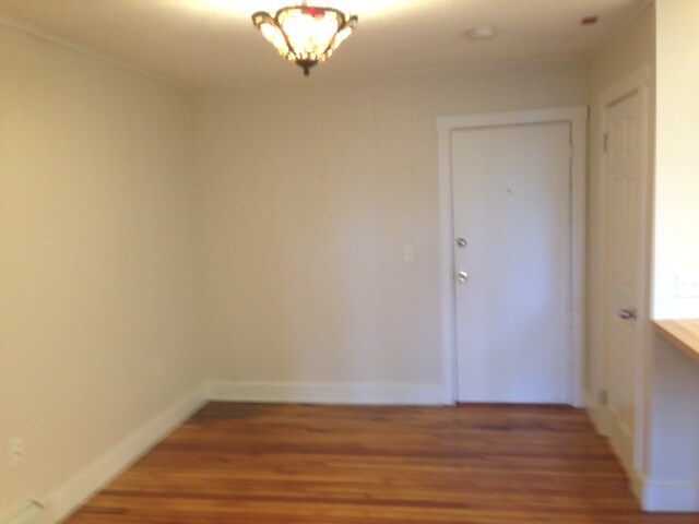 Doorway into apartment...small living area opens to kitchen - 52 E Bowery St