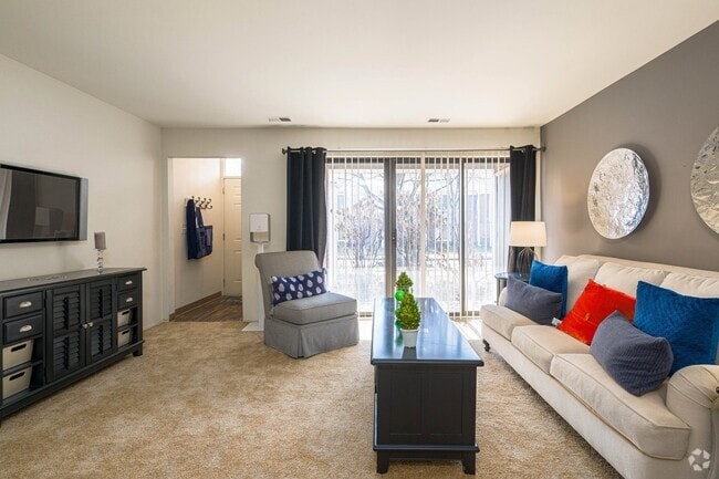 Cozy living room with natural light at Park Lane Apartments in Southfield, MI - Park Lane Apartments