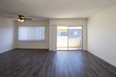 Located at 14320 Addison St in the Sherman Oaks neighborhood of Los Angeles, this single-floor residence offers a clean, updated interior with a cohesive design throughout. The living area is generously proportioned, featuring light wood-look vinyl flooring, bright white walls, and a textured ceiling. Natural light fills the space through sliding windows with vertical blinds, and a ceiling fan adds comfort and airflow to the main living space.

The kitchen is well-appointed with white shaker-style cabinetry, quartz countertops, and a charming blue subway tile backsplash. Stainless steel appliances, including a full-size refrigerator and dishwasher, complete the functional layout.

The bedrooms are carpeted for comfort and each features windows that bring in natural light. Closet space is present, with at least one bedroom offering a sliding-door closet alongside a separate storage area.

Two bathrooms serve the unit — one featuring a tub-shower combination with brushed nickel fixtures and quartz countertops, and the other offering a glass-enclosed walk-in shower with matching finishes. Both bathrooms maintain a clean, neutral palette with wood-look flooring. Throughout, the consistent use of light tones and updated materials creates a bright and move-in-ready environment.