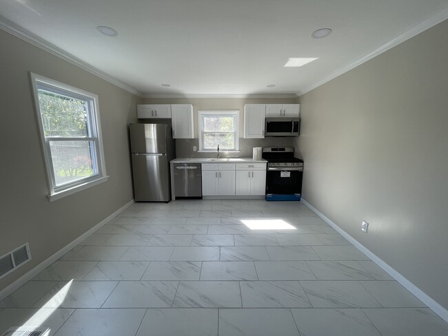 Kitchen with brand new appliances - 25 Lexington Ave