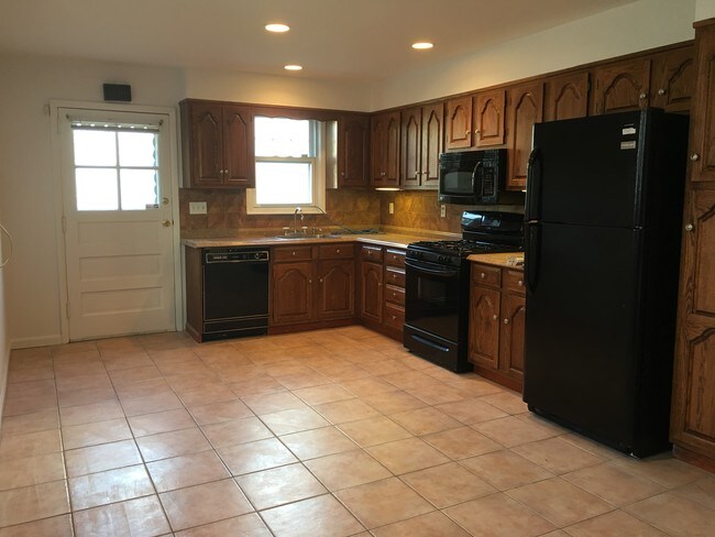 Kitchen with door to patio - 44 Perry Ave