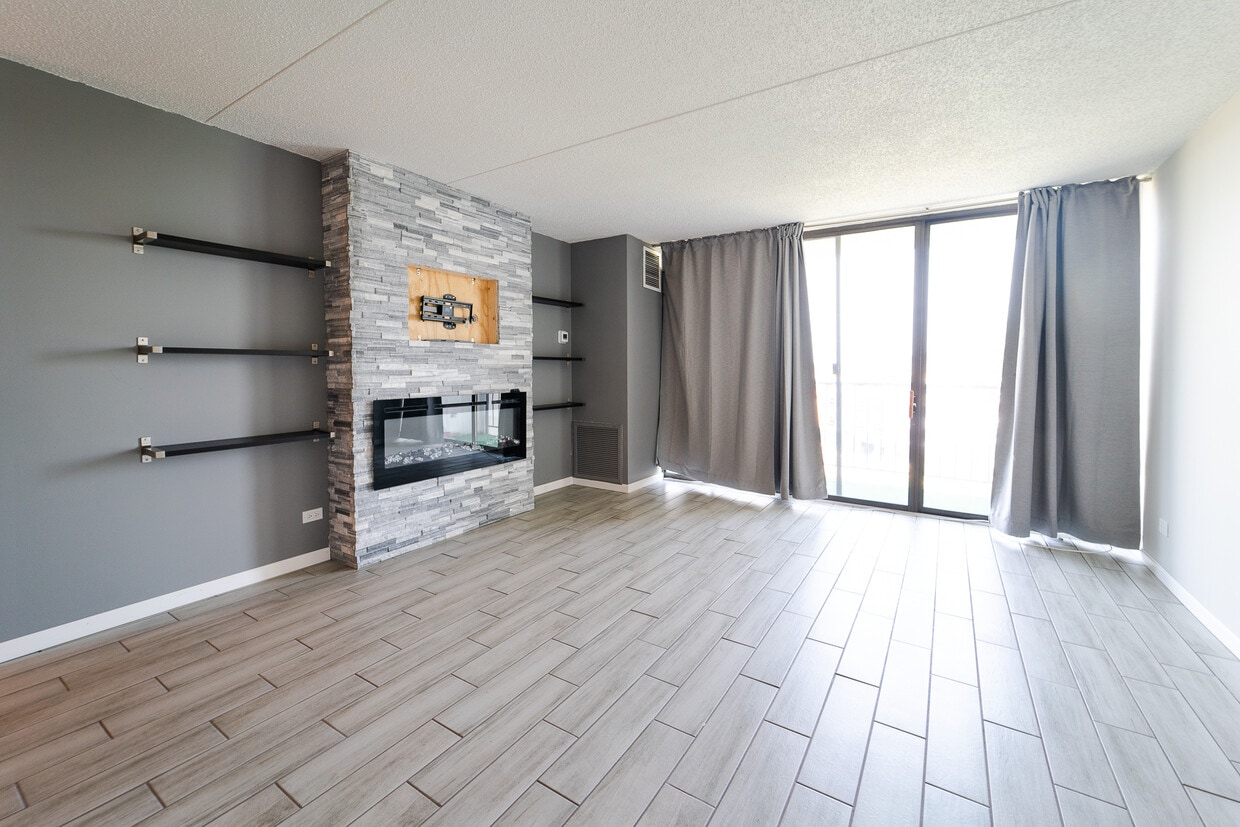 Italian tile floors. Stone from floor to ceiling with built in electric fireplace and TV mount. - 2015 S Finley Rd