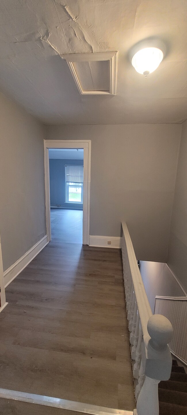 Upper Hallway facing toward the living room. - 352 Grove St