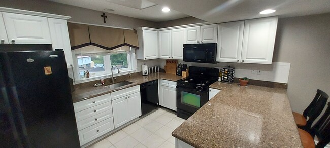 A chef's dream Kitchen! Made to entertain with Granite Countertops and dine-in bar - 203 Prairie Ct