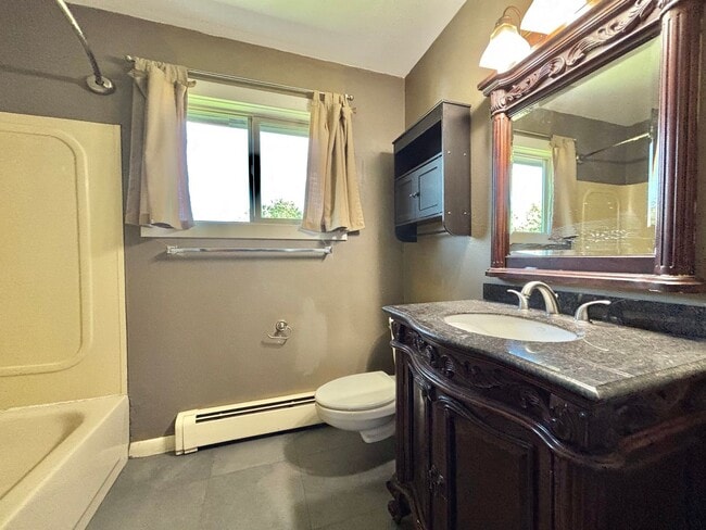 Building Photo - Spacious 4-Bedroom, 2-Bath Home with Room ...