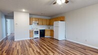 Located at 514 Finks Hideaway Rd in Monroe, Louisiana, this single-floor, one-bedroom, one-bathroom home offers a practical and efficient layout with consistent wood-look flooring running throughout every room, lending warmth and visual continuity to the entire space.

The open-concept kitchen and living area forms the heart of the home. The kitchen is equipped with warm-toned wood cabinetry offering ample upper and lower storage, light-colored countertops with a speckled backsplash, a stainless steel sink, and a full suite of white and black appliances including an electric range, dishwasher, and refrigerator. A ceiling fan overhead provides air circulation across the combined kitchen and living space, which offers a generous, open feel well-suited for everyday living.

The bedroom is a comfortable, well-proportioned room featuring a ceiling fan with light fixture, a window that allows natural light to filter in, and a full closet with paneled double doors — providing practical storage space.

The bathroom is neatly appointed with a wood-toned vanity, white countertop, a framed mirror, overhead lighting, and a full tub-shower combination. Matching cabinetry above the toilet provides additional storage.

Textured ceilings and clean white walls are present throughout, completing the home's straightforward, functional character.