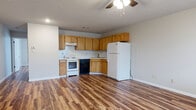 Located at 514 Finks Hideaway Rd in Monroe, Louisiana, this single-floor, one-bedroom, one-bathroom home offers a practical and efficient layout with consistent wood-look flooring running throughout every room, lending warmth and visual continuity to the entire space.

The open-concept kitchen and living area forms the heart of the home. The kitchen is equipped with warm-toned wood cabinetry offering ample upper and lower storage, light-colored countertops with a speckled backsplash, a stainless steel sink, and a full suite of white and black appliances including an electric range, dishwasher, and refrigerator. A ceiling fan overhead provides air circulation across the combined kitchen and living space, which offers a generous, open feel well-suited for everyday living.

The bedroom is a comfortable, well-proportioned room featuring a ceiling fan with light fixture, a window that allows natural light to filter in, and a full closet with paneled double doors — providing practical storage space.

The bathroom is neatly appointed with a wood-toned vanity, white countertop, a framed mirror, overhead lighting, and a full tub-shower combination. Matching cabinetry above the toilet provides additional storage.

Textured ceilings and clean white walls are present throughout, completing the home's straightforward, functional character.