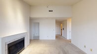 Located at 9421 S Evanston Pl in Tulsa, Oklahoma, this single-story, 3-bedroom, 3-bathroom home offers a practical and comfortable layout across a well-utilized floor plan. The living room serves as the heart of the home, featuring soaring ceilings, soft carpeting, and a tile-surround fireplace that adds warmth and character to the space. Large windows flood the area with natural light, creating a bright and airy atmosphere. Track lighting adds additional illumination to the living area. The kitchen is equipped with warm wood cabinetry, tile flooring, and a stainless steel refrigerator, offering functional workspace that opens conveniently toward the main living area. The primary bedroom is generously sized, featuring vaulted ceilings, a ceiling fan, a window with outdoor views, and access to a walk-in closet with built-in shelving. The additional bedrooms are carpeted and well-proportioned. Each of the three bathrooms includes a tiled tub-shower combination with clean, classic white tile surrounds and tile flooring. A dedicated laundry room with tile flooring, wire shelving, and washer/dryer hookups adds everyday convenience. A hallway connects the rooms, completing this cohesive and functional single-level layout.