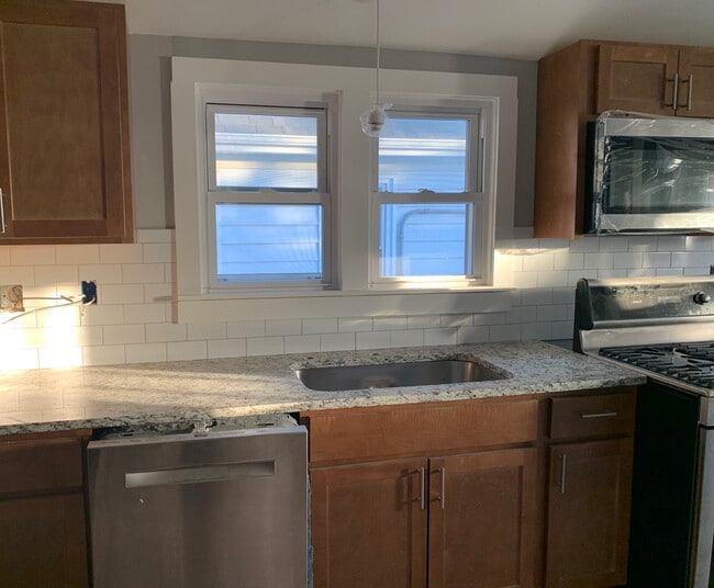 New stainless appliances, granite countertop, hand tiled backsplash. - 2163 N 62nd St