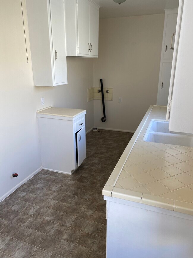 Kitchen (fridge/stove/washer) area - 1412 Benito Ave