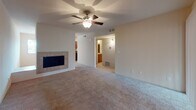 Located at 1150 N El Dorado Pl in Tucson, Arizona, this single-floor unit offers a well-organized layout with a comfortable, functional design throughout. The spacious living area serves as the heart of the home, highlighted by a tile-surround fireplace that adds warmth and character. Plush carpeting and a ceiling fan contribute to a relaxed ambiance, while an open sightline connects the living space to the adjacent hallway and bathroom beyond.

The galley-style kitchen is well-appointed with rich wood cabinetry, dark granite countertops, tile flooring, and a full suite of black appliances including a range, over-the-range microwave, refrigerator, and dishwasher. Ample counter and cabinet space make this kitchen both practical and visually cohesive.

The bedrooms are carpeted and comfortably sized, each equipped with ceiling fans and vertical blind-covered sliding glass doors or windows that allow for natural light and outdoor access. The bathroom features a full tub and shower combination with floor-to-ceiling speckled granite-style tile surround, providing a clean and durable finish.

Throughout the unit, neutral tones, consistent flooring choices, and thoughtful ventilation create a cohesive and livable environment suited to the warm Tucson climate.