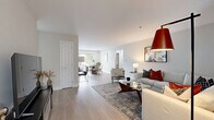 Located at 200 Eastwick Dr in Reading, PA, this well-appointed 2-bedroom, 3-bathroom single-floor home offers a clean, modern aesthetic with thoughtful finishes throughout. The open living room is bright and welcoming, featuring light wood-look flooring, neutral walls, and natural light streaming through curtained windows — an ideal space for relaxing or entertaining. The kitchen is a standout, showcasing two-tone cabinetry with light upper cabinets and rich dark lower cabinets, white quartz countertops, a classic subway tile backsplash, and a full suite of stainless steel GE appliances. The spacious primary bedroom features plush carpet, dual closets, and a window with natural light, while the second bedroom mirrors the same comfortable, carpeted design with multiple windows. The primary bathroom is elegantly appointed with dual LED-lit vanity mirrors, a double sink vanity with white cabinetry, and large-format tile flooring. A clean, minimalist half bath provides added convenience. The dedicated laundry room houses a full-size washer and dryer with overhead wire shelving for storage. A connecting hallway ties each room together efficiently, completing this well-designed, move-in-ready home.