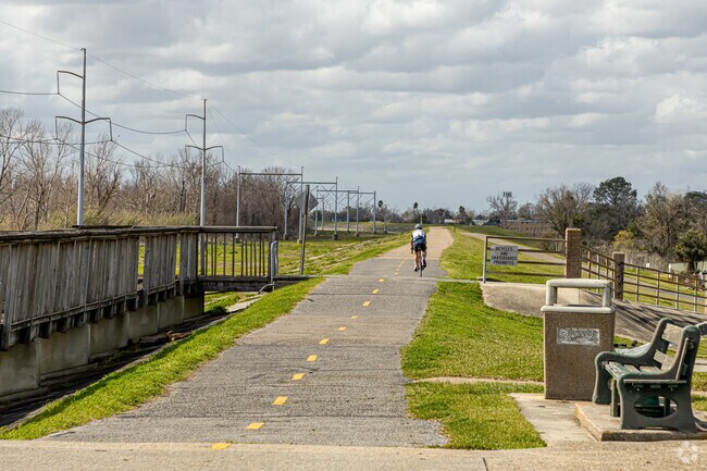 Cyclist on the Mississippi River Levee at La Salle’s Landing