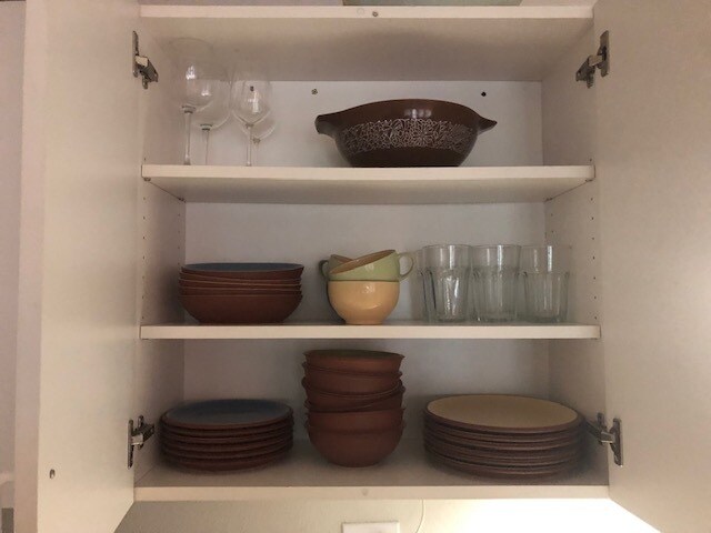 Plates, bowels, cups, wine glasses, mixing bowls, all matching and good quality make you feel at home. - 7595 SW Onnaf Ct