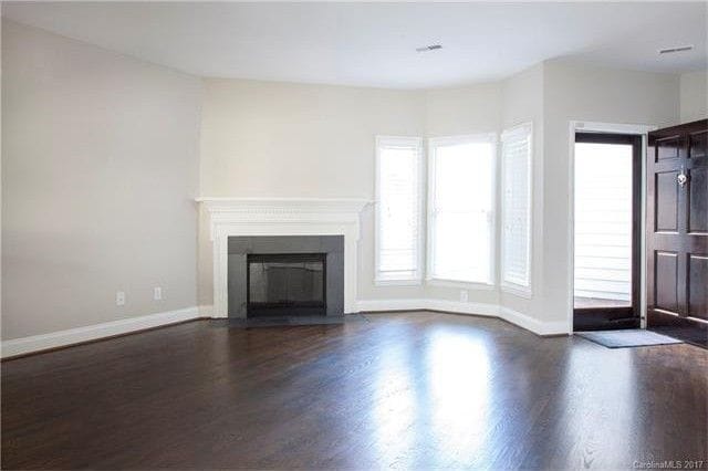Open living area with natural fireplace - 404 Clarkson Green St
