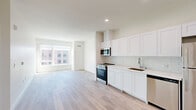 Located at 1720 Research Park Dr in Davis, CA, this modern 2-bedroom, 2-bathroom residence offers a clean, contemporary design throughout. Light wood-tone flooring flows seamlessly across the entire single-level layout, creating a cohesive and bright aesthetic.

The open-concept kitchen and living area serves as the heart of the home. The kitchen is outfitted with white shaker-style cabinetry, a classic subway tile backsplash, light quartz countertops, stainless steel appliances including a range, over-the-range microwave, and dishwasher, and a undermount sink. Large windows flood the living area with abundant natural light and offer views of the surrounding neighborhood.

Both bedrooms are well-proportioned, featuring large windows that bring in plenty of sunlight and provide outdoor views. The primary bedroom is generously sized and includes dedicated closet space. Each bedroom benefits from a clean, neutral palette of crisp white walls that complement the light flooring.

The two bathrooms are finished with light, modern materials, featuring white cabinetry with dark countertops, a shower-tub combination, and wood-tone flooring consistent with the rest of the unit. Additional closet storage is available throughout the residence. The entry foyer provides a clean transition into the open living spaces.