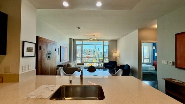 Building Photo - FURNISHED Modern 1BR + Den/1BA w/ Breathta...