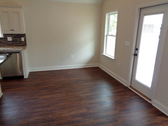 Building Photo - Spacious 4BR Home with Open Split Floor Plan, Granite Kitchen & Fenced Yard