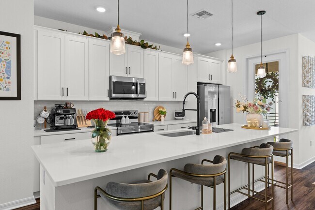 Foto del edificio - Upgraded 3BR/3.5BA Laureate Park Townhome | 2-Car Garage + EV Charging