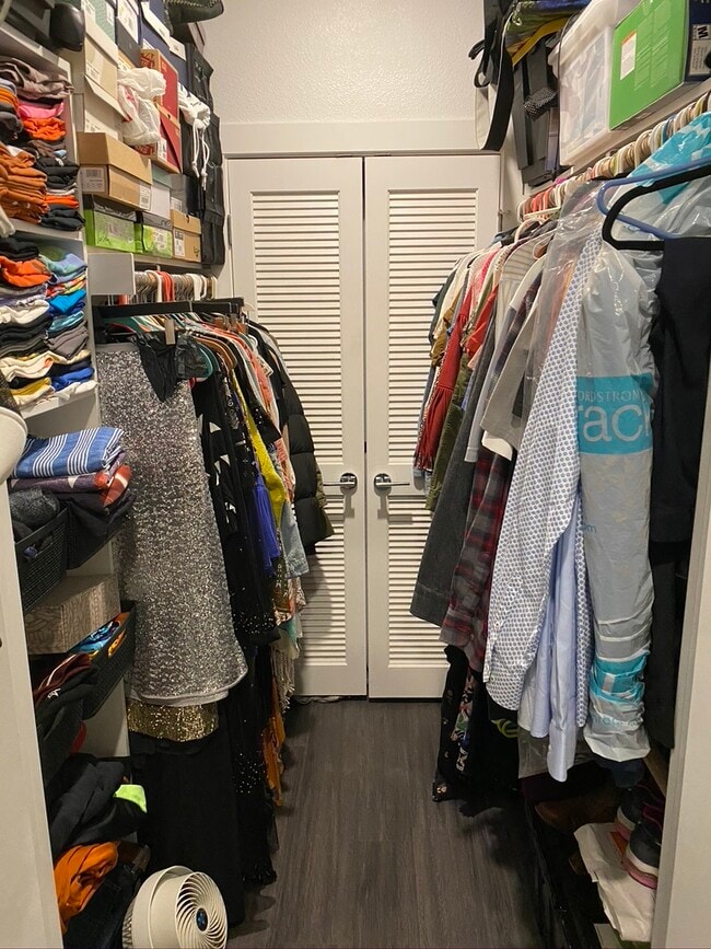 (a very full) walk-in closet - 4361 S Congress Ave