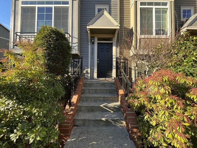 Building Photo - Thoughtfully Designed Three-Bedroom Home on a Corner Lot with Private Lower-Level Bedroom and Ens...