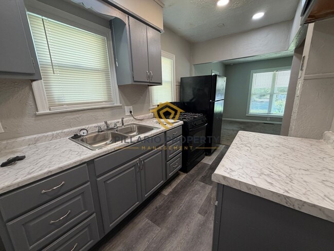 Photo - Charming 3-Bedroom Stone Bungalow with 2-Car Detached Garage & Fenced Yard, Available NOW! House