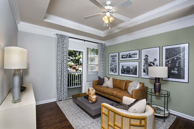 Bright Living Room with Crown Molding - Castle Creek Apartments