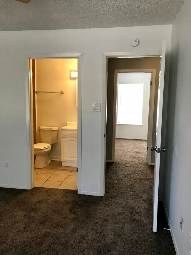 First bedroom has its own full bathroom. - 501 Dallas St