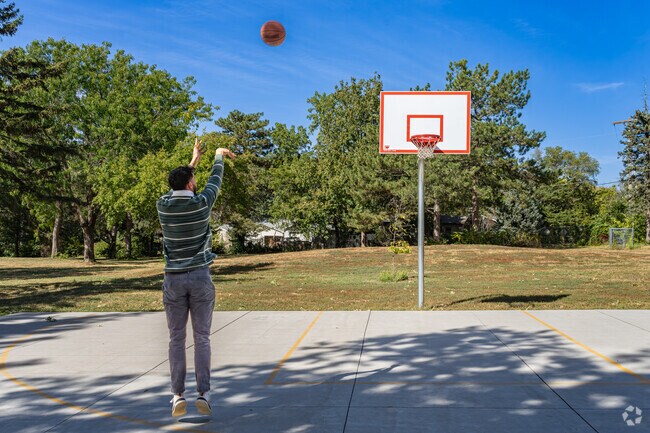 A Woods Park resident shoots some hoops during his lunch break.