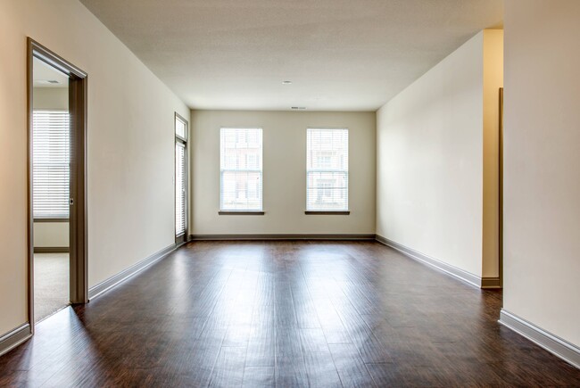 Living Room with Hardwood-Style Flooring - Double Creek Flats Apartments