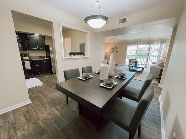 Dining Area with Wood Style Flooring - The Preserve at Woodland