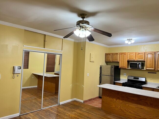Overhead storage and ample closet with builtin shelves - 2115 33rd St