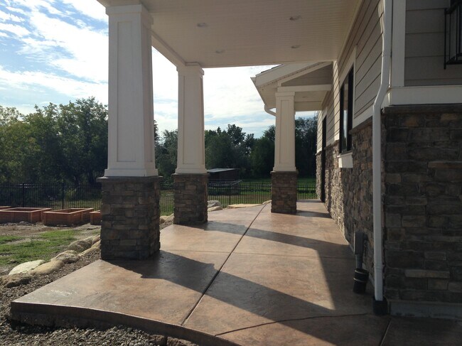 East side of house toward entry - 1107 W Old Millrace Ln