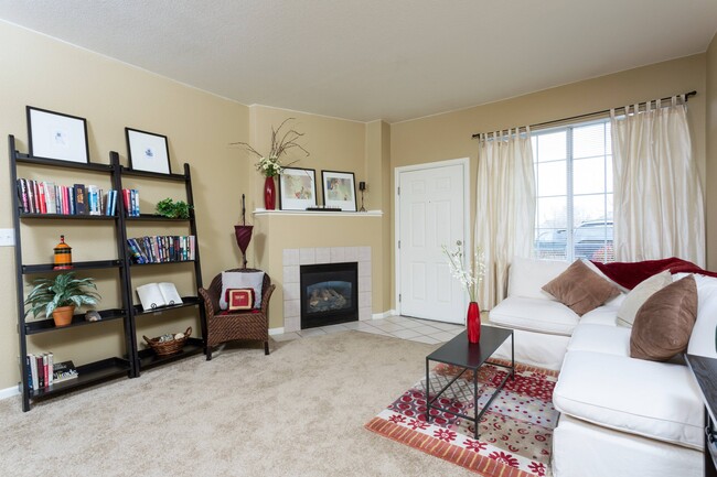 Living Room with Fireplace - PeakView at T-Bone Ranch Apartments