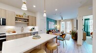 Located at 13342 Midway Rd in Farmers Branch, TX, this well-appointed one-bedroom, one-bathroom residence offers a thoughtfully designed single-floor layout with a cohesive and vibrant mid-century modern aesthetic. Light wood-tone flooring flows throughout, complementing the warm, colorful design choices found in every room.

The kitchen is a standout, featuring light wood cabinetry with gold hardware, a white quartz waterfall island with bar seating, stainless steel appliances, a subway tile backsplash, and pendant lighting — creating a functional yet stylish culinary space.

The living room exudes character with a bold teal accent wall, a plush rust-colored velvet sofa, a multicolored striped area rug, and large French doors that open to a private balcony. The balcony overlooks a resort-style courtyard and pool, offering a relaxing outdoor retreat.

The bedroom continues the teal accent wall theme, enhanced by large windows that fill the room with natural light, a ceiling fan, and warm, eclectic décor. It connects to a dedicated closet for ample storage.

The bathroom features light wood vanity cabinetry, a glass-enclosed walk-in shower with marble-style tile, and direct access to the walk-in closet, ensuring a seamless and functional layout throughout this vibrant, modern residence.