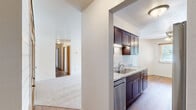 Located at 326 Rawson St, Unit J2, in Dundee, Michigan, this single-floor unit offers three bedrooms and one bathroom across a well-utilized floor plan. The living area features plush carpeting and a sliding glass door that invites abundant natural light while providing outdoor views, complemented by a ceiling fan for added comfort. The adjoining dining or flex area features hardwood-style flooring, adding warmth and contrast to the neutral palette throughout.

The generously sized primary bedroom stands out as the largest room in the home, offering dual built-in closets with classic oak bifold doors and soft carpeting underfoot. The two additional bedrooms are comfortably sized, each with carpeted floors and windows fitted with wood-trimmed blinds that allow for natural light.

The bathroom has been thoughtfully updated and features a walk-in shower with marble-look surround panels and a curtain rod enclosure, paired with a dark espresso vanity topped with a stone-veined countertop. A large mirror and clean finishes round out this functional space.

Throughout the unit, warm oak-toned doors and trim provide a cohesive design element, while the bright, neutral walls create a clean and move-in ready atmosphere. The efficient layout makes excellent use of every square foot this home has to offer.