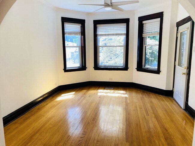 Sunny front room, all original woodwook - 2014 W Fletcher St