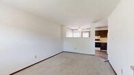 Located at 5398 Rockingham Ct in Westerville, Ohio, this three-floor home offers a practical and well-organized layout across its total living area. The main level features a living room that provides a comfortable gathering space, while staircases connect all three floors seamlessly. The upper floor houses two carpeted bedrooms, each featuring ceiling fans with integrated lighting and window blinds that allow for natural light. The primary bedroom includes closet access and ample room for furnishings. The second bedroom is similarly appointed, with its own ceiling fan and window. A full bathroom on this level is equipped with a tub-shower combination, tile surround in warm neutral tones, a mosaic tile floor, vanity with storage, and a textured ceiling. The lower level offers a versatile utility and bonus space featuring durable laminate flooring, wood-paneled accent walls, and a small egress window that brings in natural light—ideal for use as a recreation room or storage area. Dark wood door and window trim appear consistently throughout the home, providing a cohesive design element. The home's multi-level structure, functional room count, and practical finishes make it a well-rounded residential property in the Westerville community.