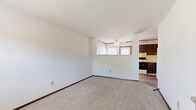 Located at 5398 Rockingham Ct in Westerville, Ohio, this three-floor home offers a practical and well-organized layout across its total living area. The main level features a living room that provides a comfortable gathering space, while staircases connect all three floors seamlessly. The upper floor houses two carpeted bedrooms, each featuring ceiling fans with integrated lighting and window blinds that allow for natural light. The primary bedroom includes closet access and ample room for furnishings. The second bedroom is similarly appointed, with its own ceiling fan and window. A full bathroom on this level is equipped with a tub-shower combination, tile surround in warm neutral tones, a mosaic tile floor, vanity with storage, and a textured ceiling. The lower level offers a versatile utility and bonus space featuring durable laminate flooring, wood-paneled accent walls, and a small egress window that brings in natural light—ideal for use as a recreation room or storage area. Dark wood door and window trim appear consistently throughout the home, providing a cohesive design element. The home's multi-level structure, functional room count, and practical finishes make it a well-rounded residential property in the Westerville community.