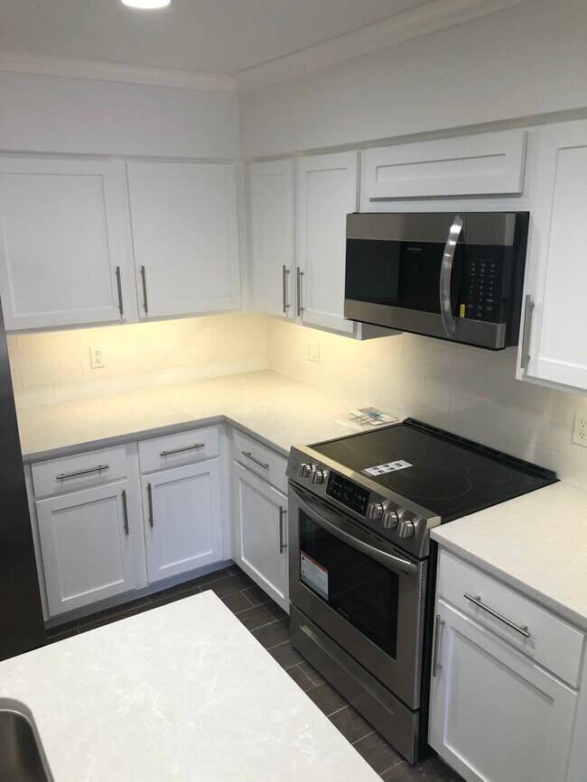 Kitchen with Quartz countertops - 9009 N May Ave