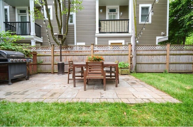 Shared Patio area with table, chairs and grill - 22-2 Lake St