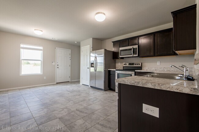 Building Photo - 4BR Home w/Fenced Yard