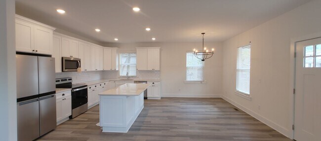 Building Photo - 5-bedroom home with 3 car garage and fully...