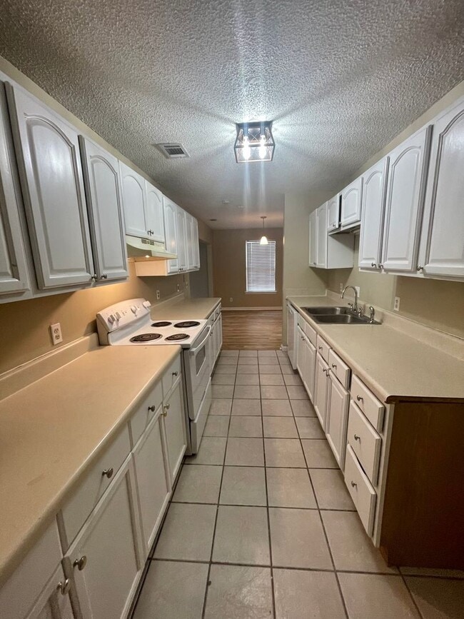 Building Photo - Spacious 4-Bedroom, 2-Bath Home with Fenced Backyard & Lawn Care Included